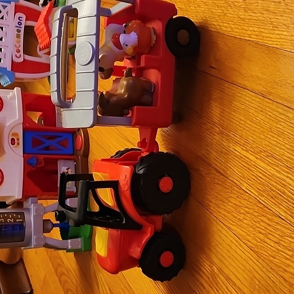 Fisher price barn, little people tractor, and cocmelon barn - Picture 2 of 4
